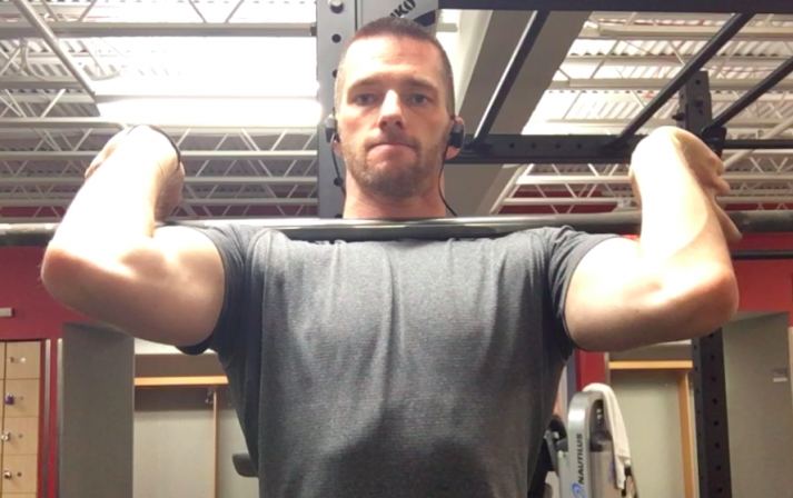 If you have longer than average forearms or poor wrist mobility, grabbing the bar with a wider grip can help