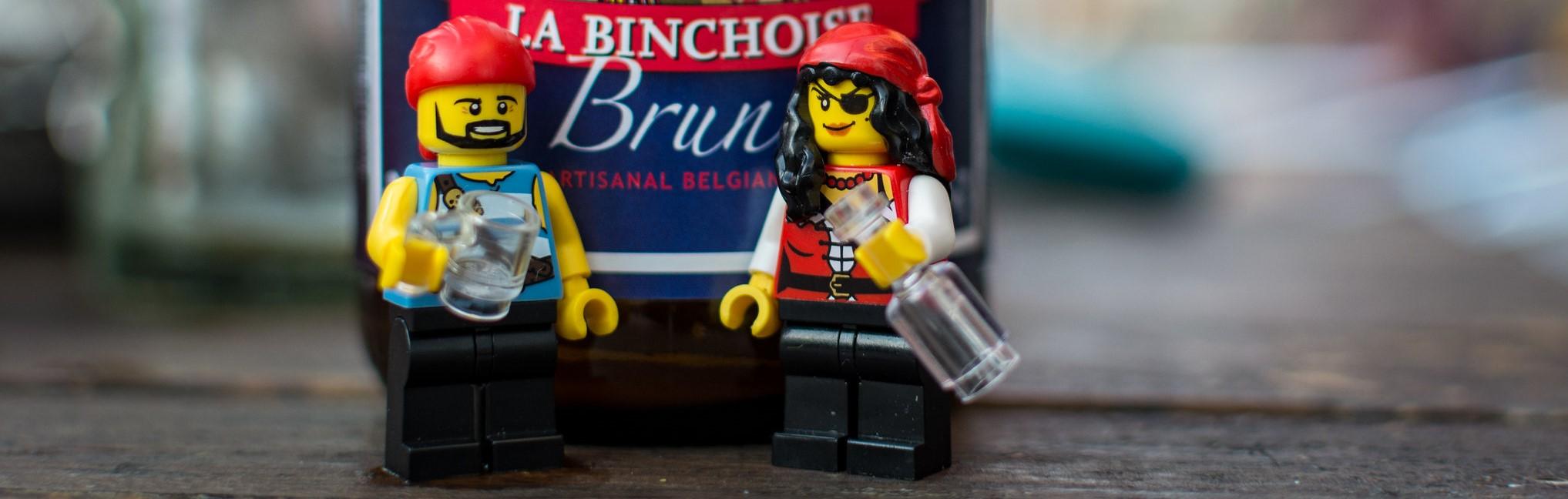 A picture of two LEGOs drinking in front of a beer bottle...in February.